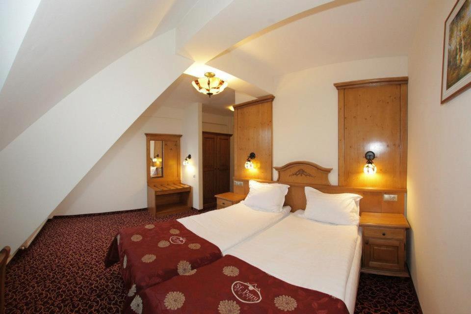 Postel nebo postele na pokoji v ubytování Resort Sf Petru