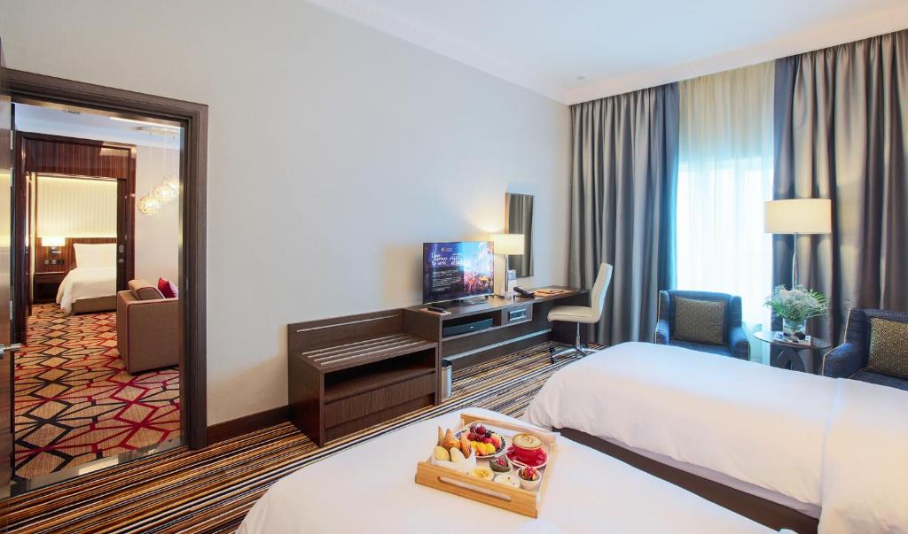 Postel nebo postele na pokoji v ubytování Dusit D2 Kenz Hotel Dubai