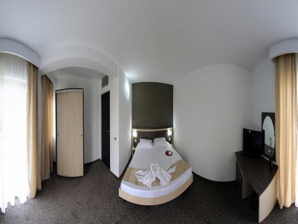 Postel nebo postele na pokoji v ubytování Hotel Solymar