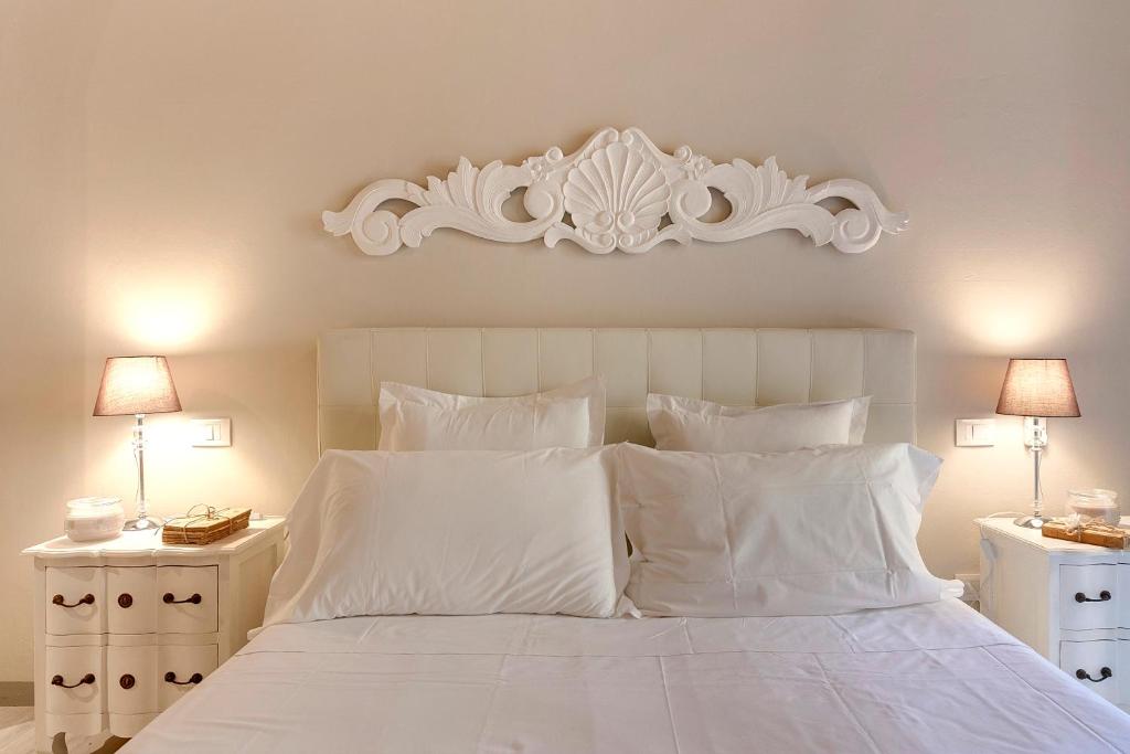 Łóżko lub łóżka w pokoju w obiekcie Courtyard Suite