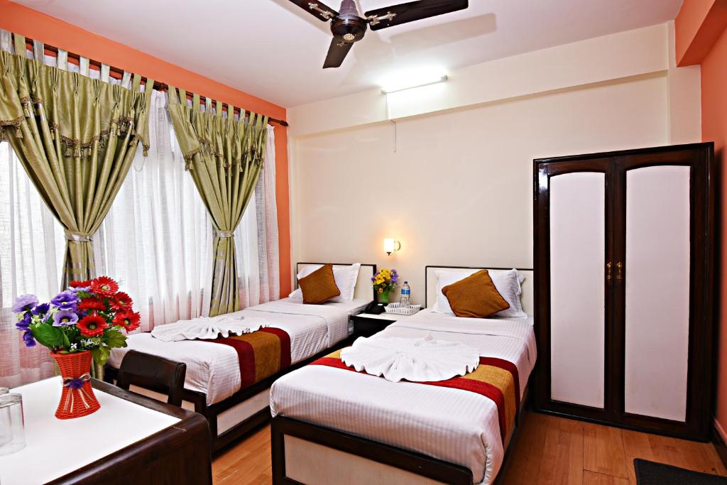 Postel nebo postele na pokoji v ubytování Hotel Pleasure Home