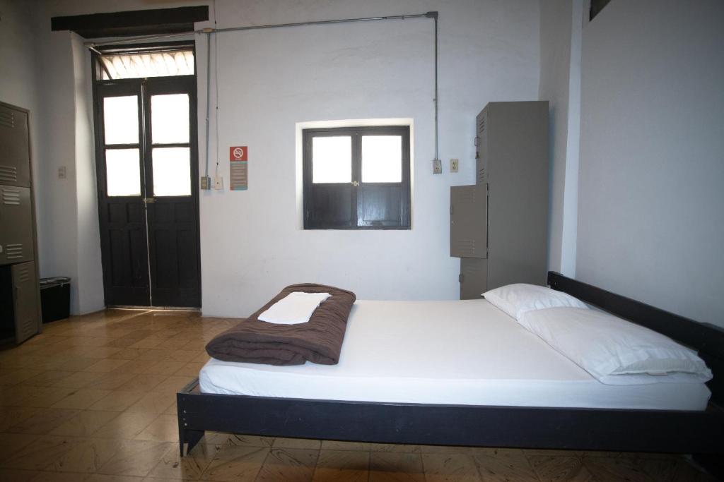 Postel nebo postele na pokoji v ubytování El Petate Hostel