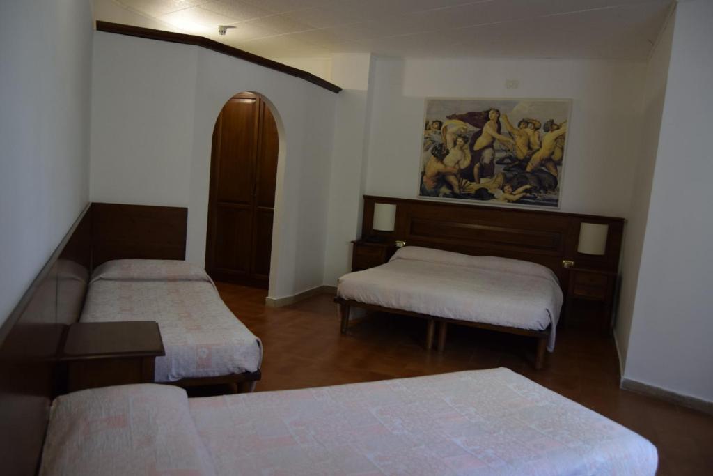 Postel nebo postele na pokoji v ubytování Albergo Del Sole