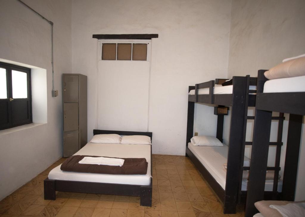 Postel nebo postele na pokoji v ubytování El Petate Hostel