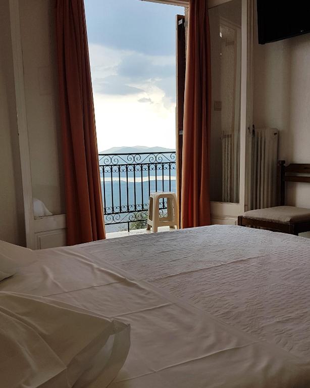 Postel nebo postele na pokoji v ubytování Hotel Orfeas