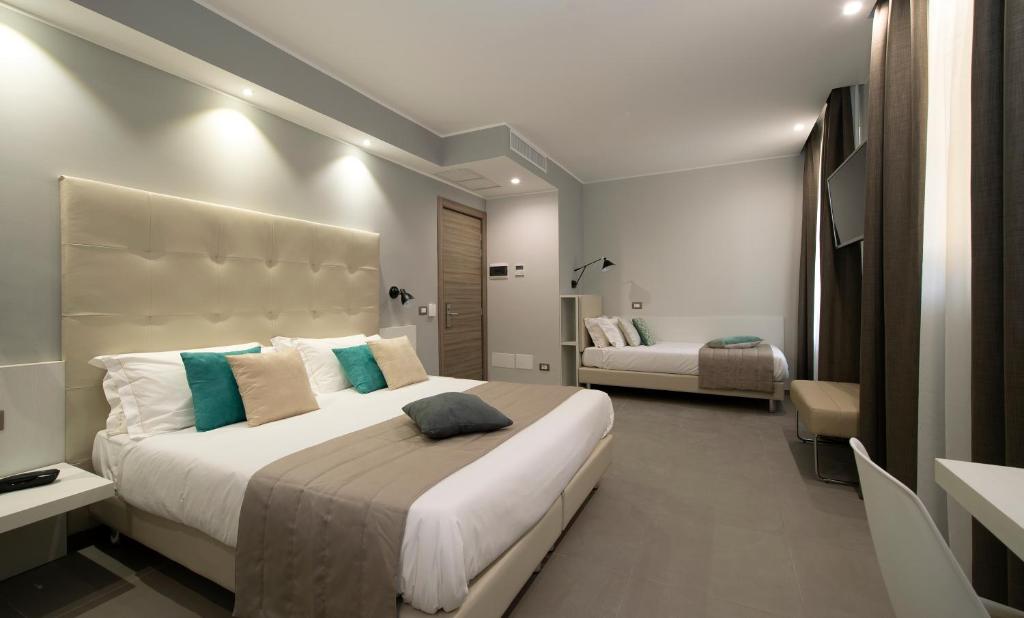 Postel nebo postele na pokoji v ubytování Hotel H21