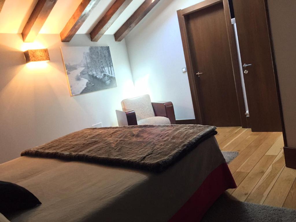 Postel nebo postele na pokoji v ubytování Posada Real Torre Berrueza