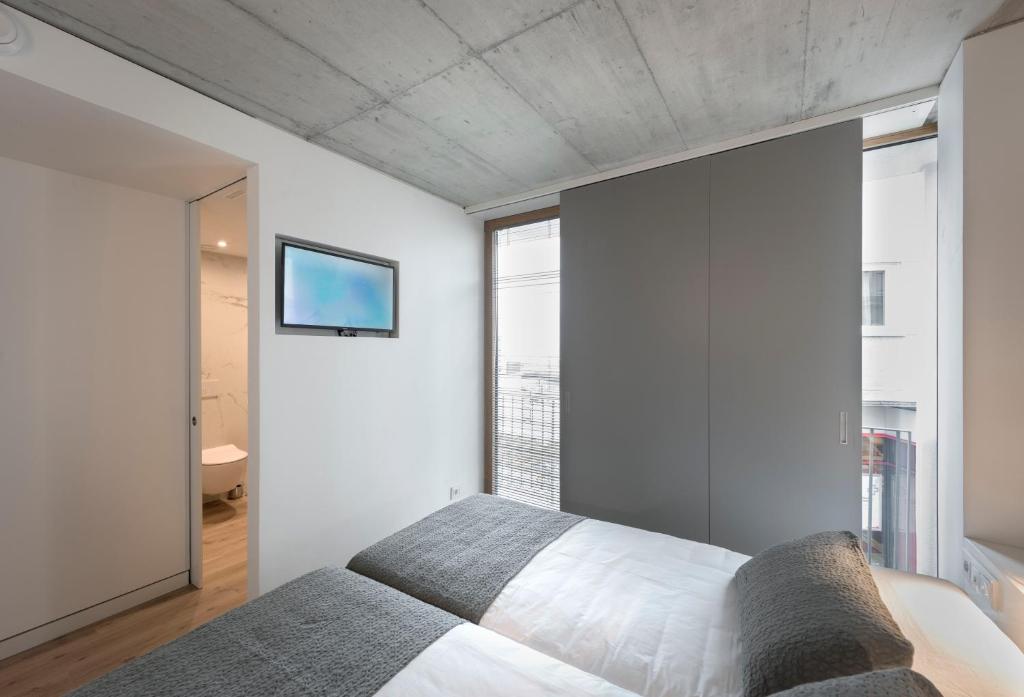 Cama o camas de una habitación en Hotel SempreFisterra