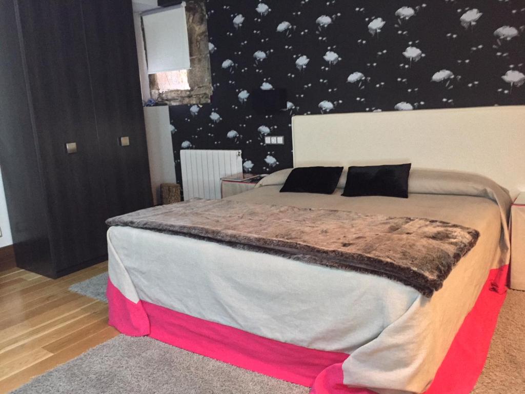 Postel nebo postele na pokoji v ubytování Posada Real Torre Berrueza