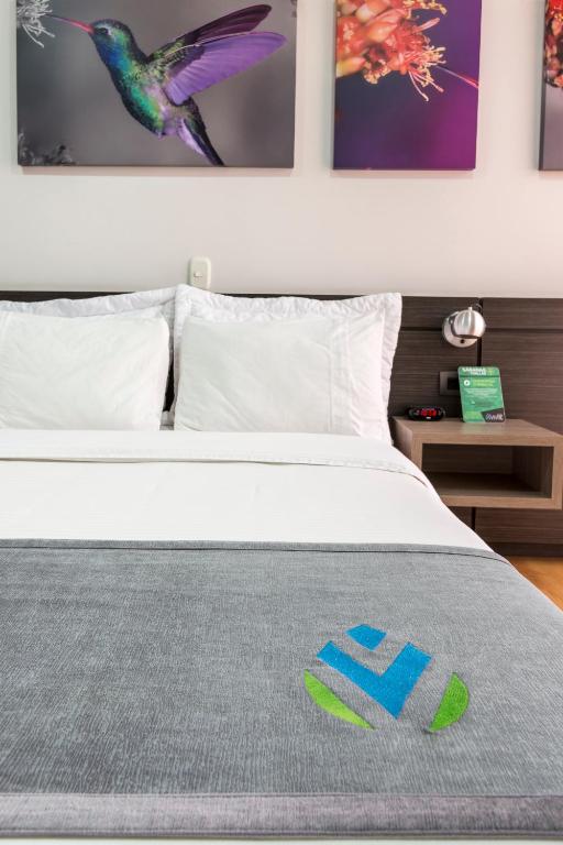 Postel nebo postele na pokoji v ubytování Hotel Vivre