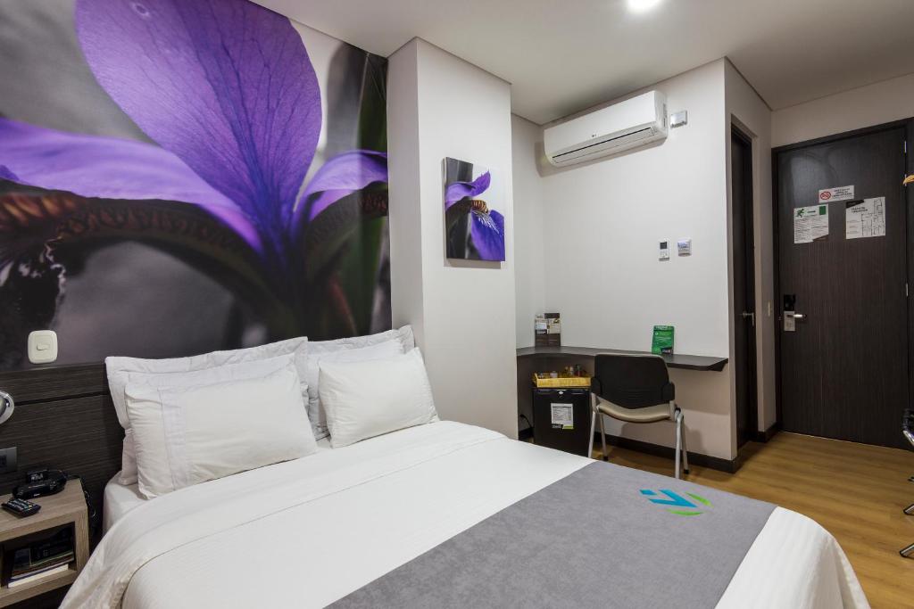 Postel nebo postele na pokoji v ubytování Hotel Vivre