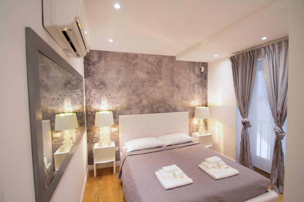 Krevet ili kreveti u jedinici u okviru objekta Apartment Via del Corso
