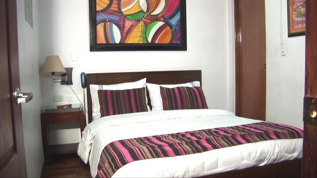 Postel nebo postele na pokoji v ubytování Hotel Apartasuite Normandia