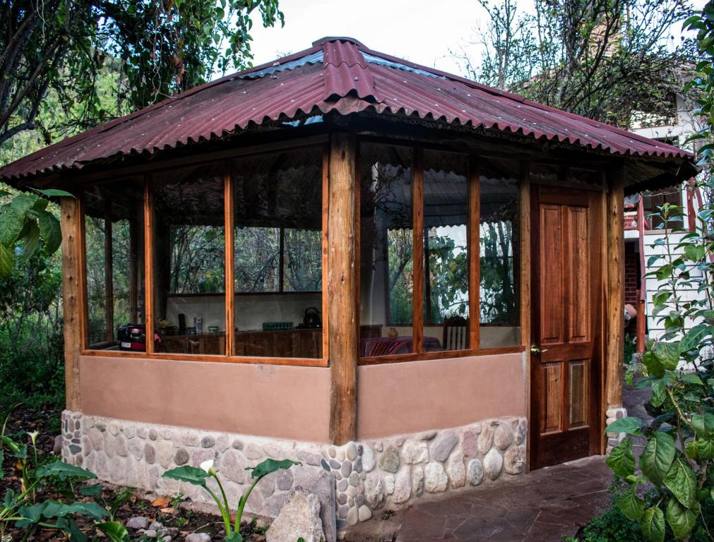 a small gazebo in a garden at Eco Lodge Los Perales-Urubamba in Urubamba