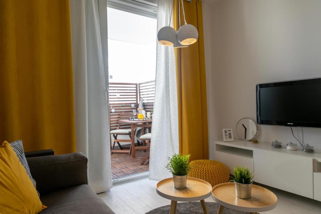 Televízia a/alebo spoločenská miestnosť v ubytovaní City apartment Marlo