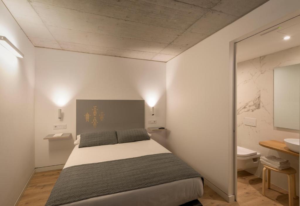 Cama o camas de una habitación en Hotel SempreFisterra