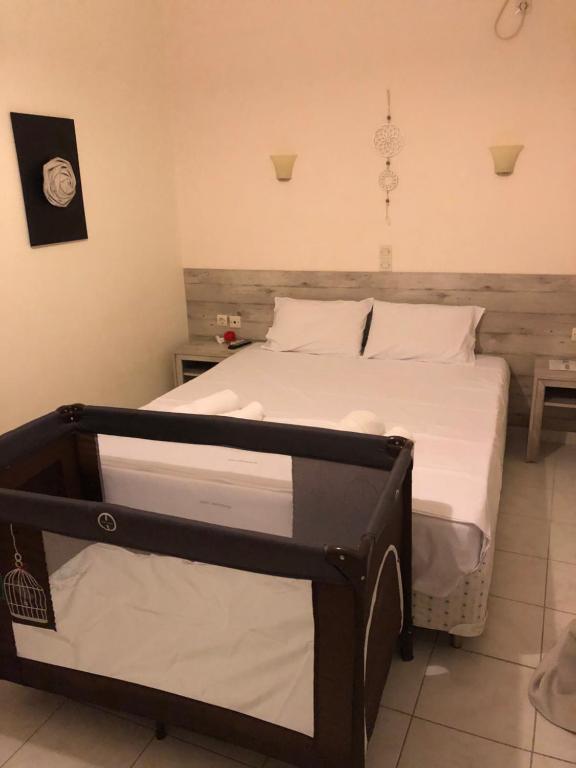 Postel nebo postele na pokoji v ubytování Iason Apartments