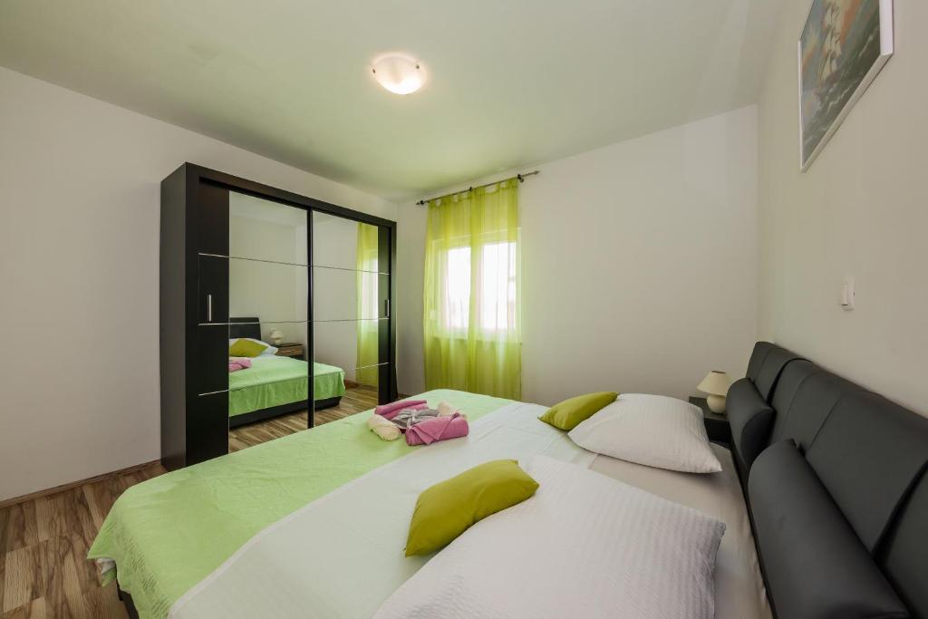 Posteľ alebo postele v izbe v ubytovaní Apartman Adriatic