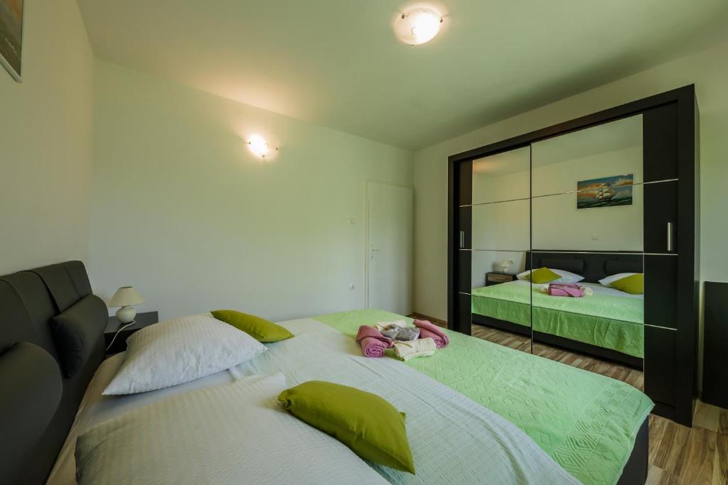 Posteľ alebo postele v izbe v ubytovaní Apartman Adriatic