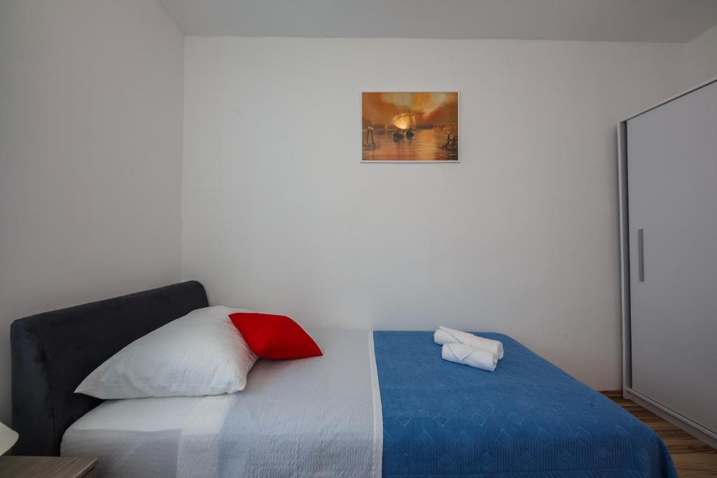 Posteľ alebo postele v izbe v ubytovaní Apartman Adriatic