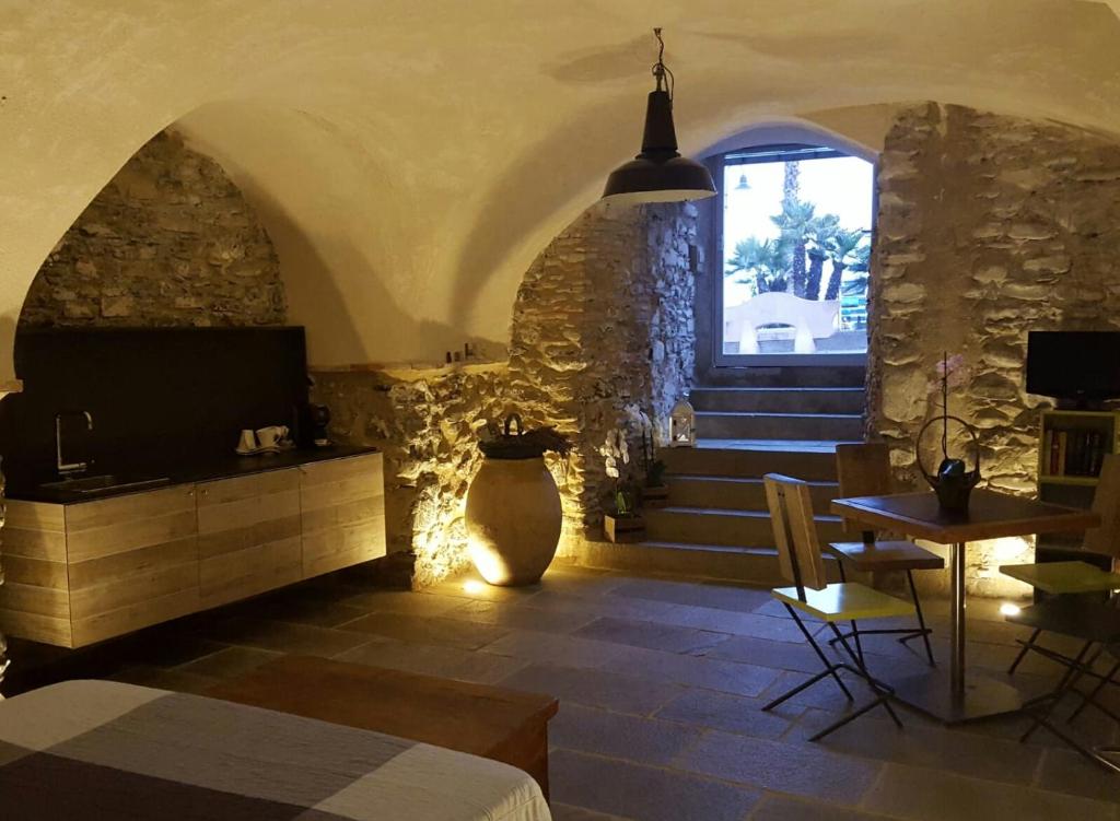 a room with a staircase and a vase on the floor at Loft al mare in San Lorenzo al Mare