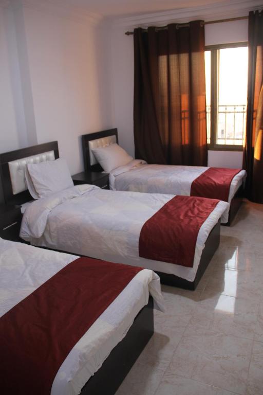 Postel nebo postele na pokoji v ubytování Weekend Hotel