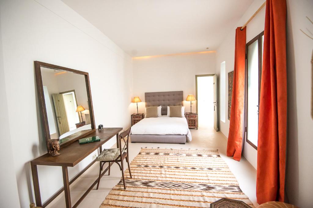 Uma cama ou camas num quarto em Riad Alia