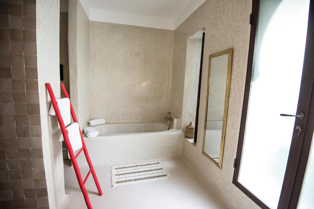 Uma cama ou camas num quarto em Riad Alia