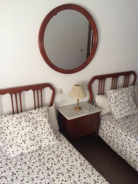 A bed or beds in a room at Alojamiento Turístico Las Catonas de Antoñanzas