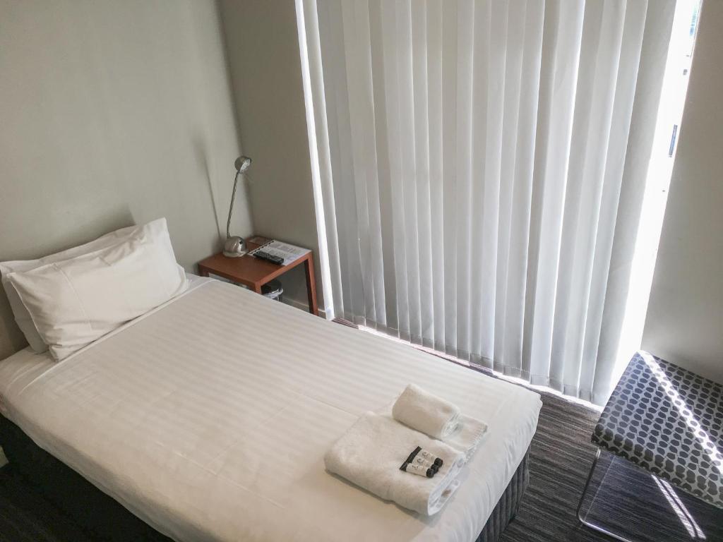 Postel nebo postele na pokoji v ubytování The Premier Hotel Broadmeadow