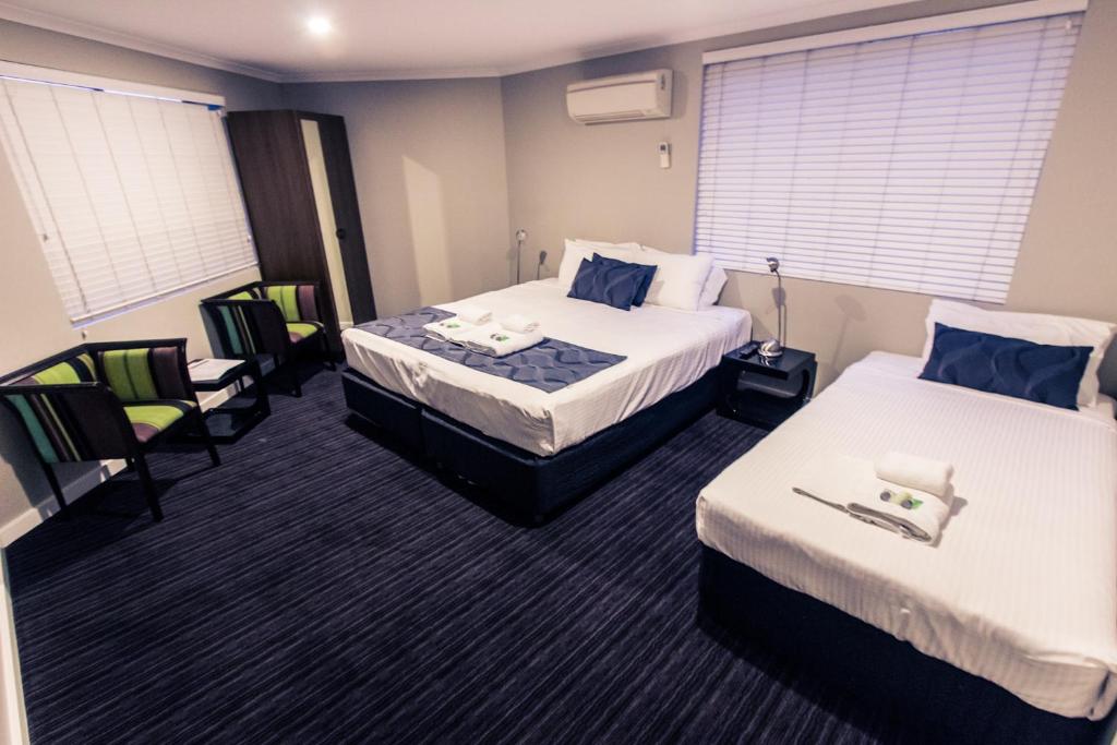 Postel nebo postele na pokoji v ubytování The Premier Hotel Broadmeadow