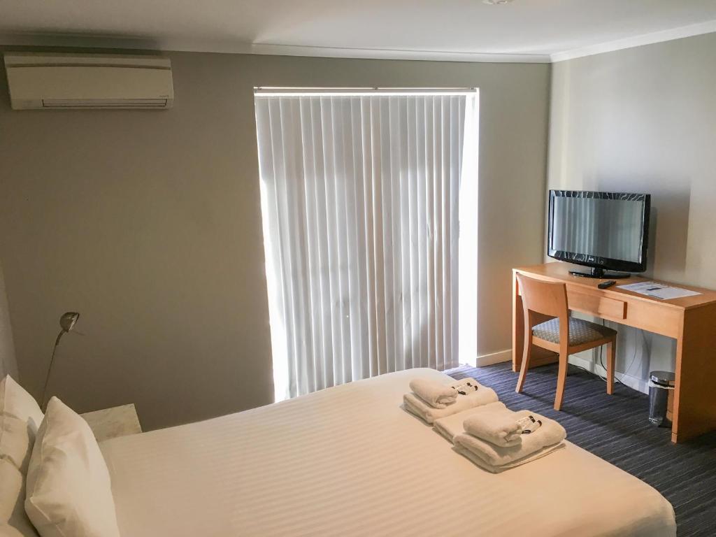 Postel nebo postele na pokoji v ubytování The Premier Hotel Broadmeadow