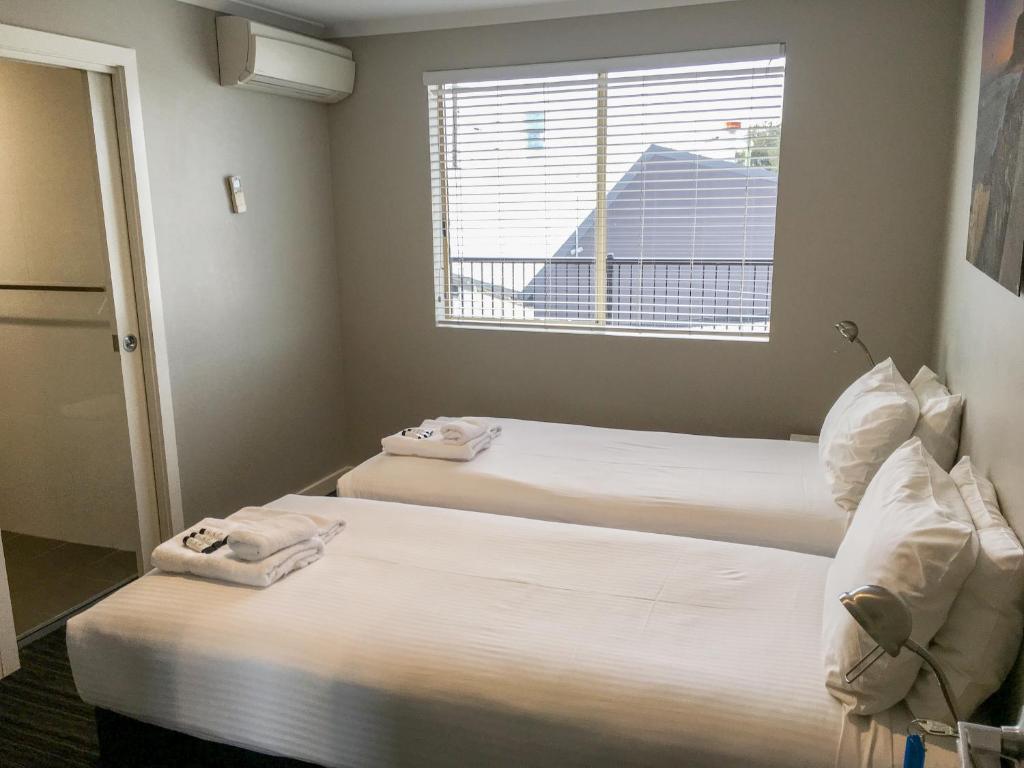 Postel nebo postele na pokoji v ubytování The Premier Hotel Broadmeadow