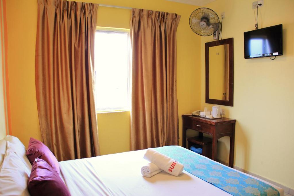 Katil atau katil-katil dalam bilik di Sun Inns Hotel Sitiawan