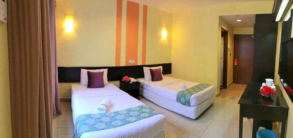 Katil atau katil-katil dalam bilik di Sun Inns Hotel Sitiawan