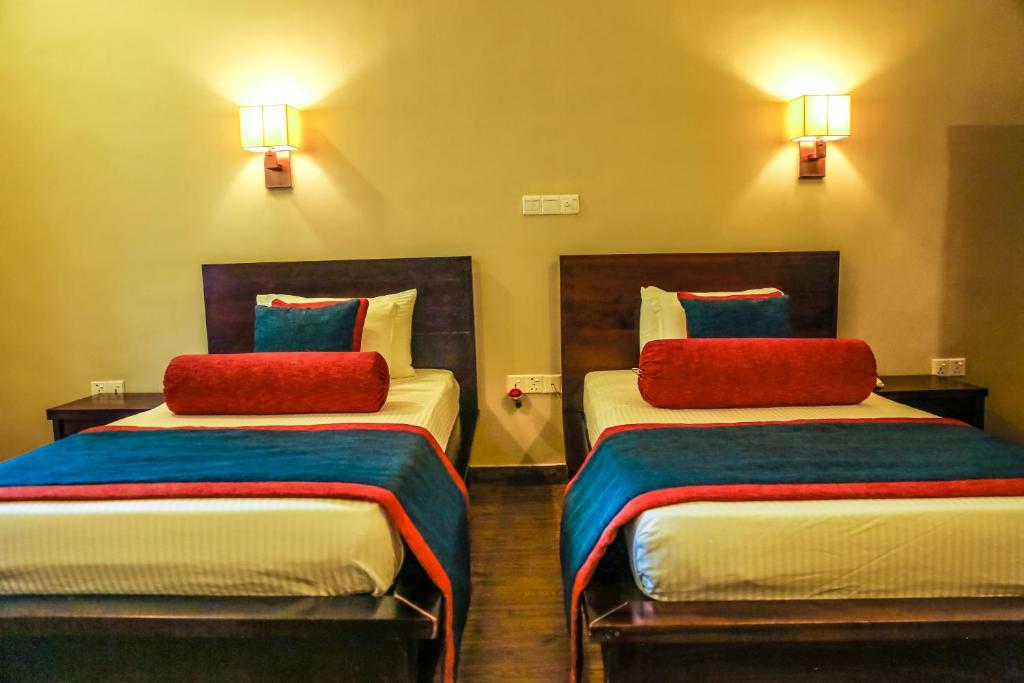 Postel nebo postele na pokoji v ubytování Oak Ray Ella Gap Hotel