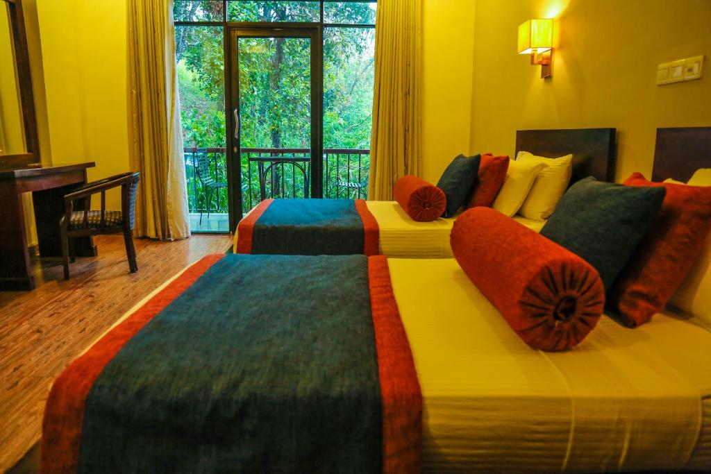 Postel nebo postele na pokoji v ubytování Oak Ray Ella Gap Hotel