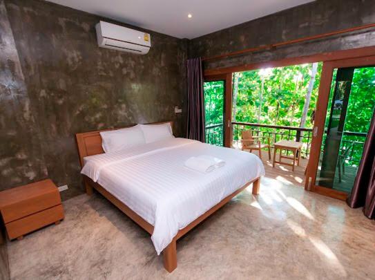 Postel nebo postele na pokoji v ubytování Chiang Klong Riverside Resort