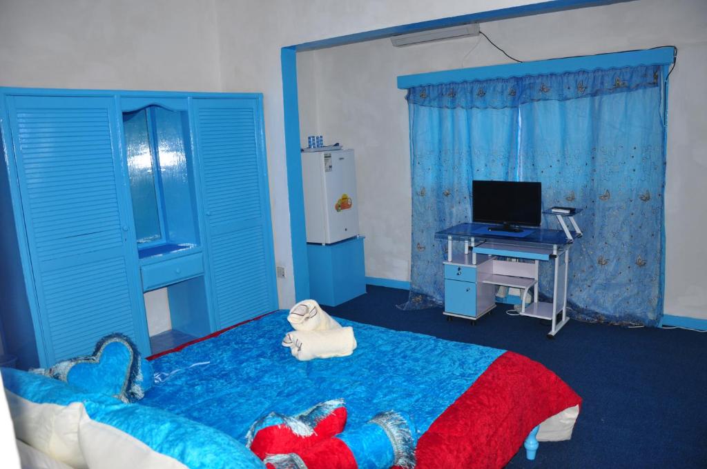 Postel nebo postele na pokoji v ubytování Le Chateau Bleu