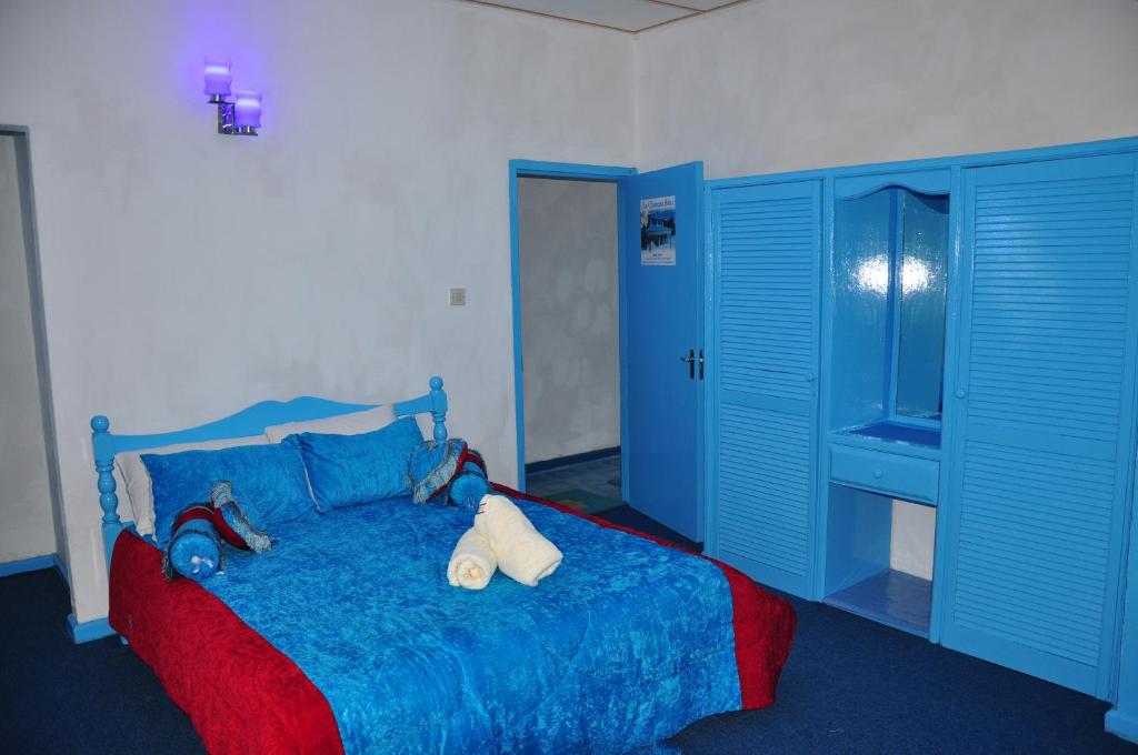 Postel nebo postele na pokoji v ubytování Le Chateau Bleu