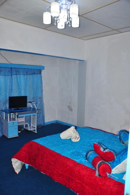 Postel nebo postele na pokoji v ubytování Le Chateau Bleu