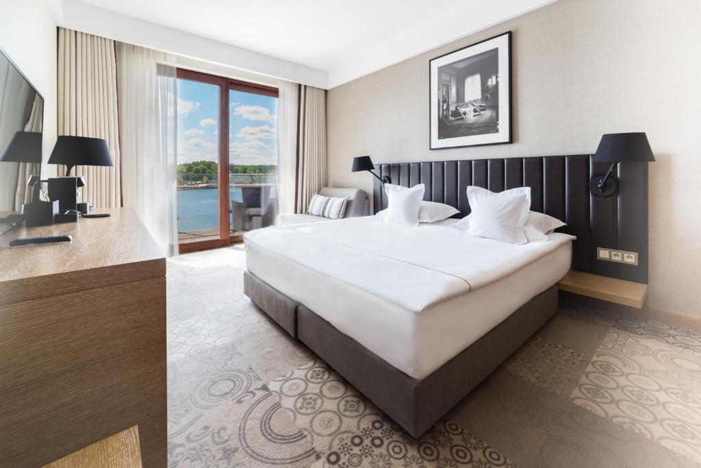 Posteľ alebo postele v izbe v ubytovaní Tiffi Boutique Hotel
