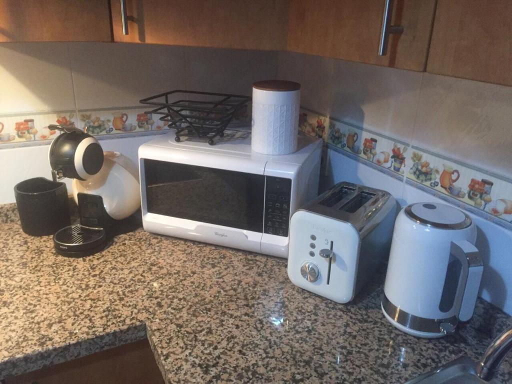Kuchyň nebo kuchyňský kout v ubytování Flamingo Apartment Coto Real La Duquesa