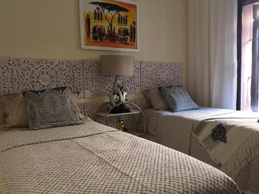 Postel nebo postele na pokoji v ubytování Flamingo Apartment Coto Real La Duquesa