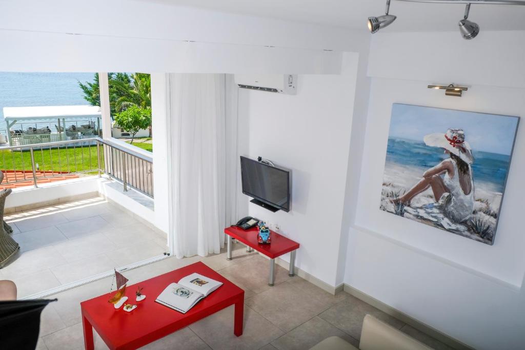 a living room with a view of the ocean at Acrotel Athena Villa in Elia