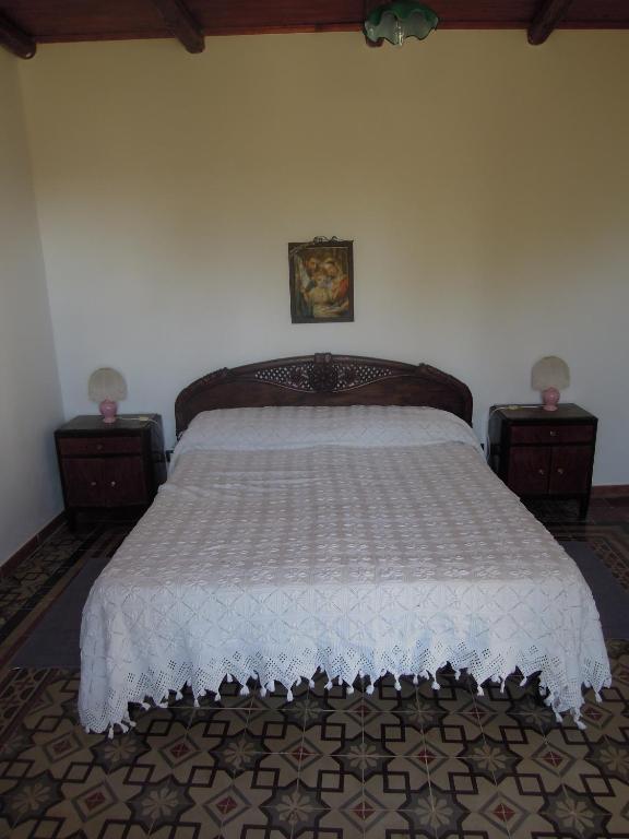 Postel nebo postele na pokoji v ubytování Agriturismo Cuca
