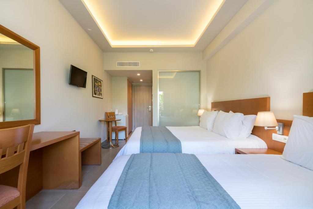 Postel nebo postele na pokoji v ubytování Hotel Palmyra