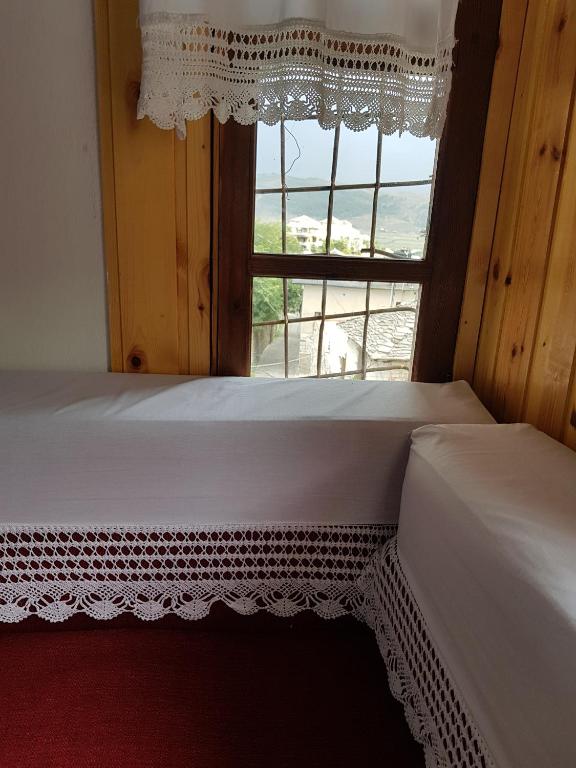 Postel nebo postele na pokoji v ubytování Eva Guesthouse