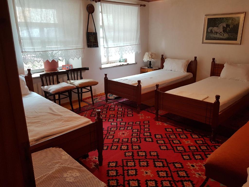 Postel nebo postele na pokoji v ubytování Eva Guesthouse