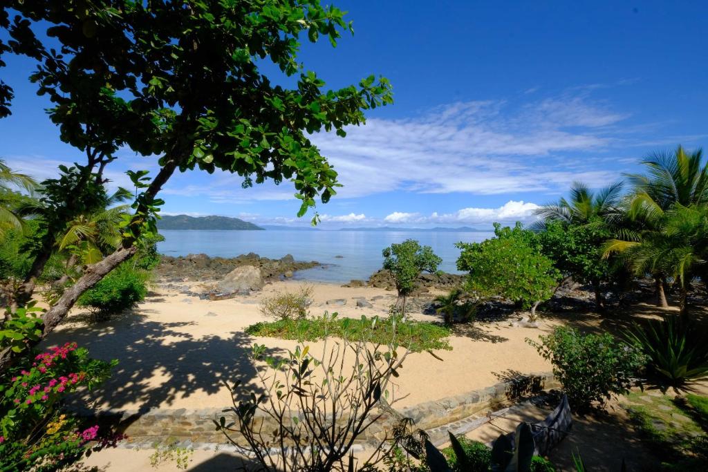 a beach with a view of the ocean at Coco Komba Lodge in Nosy Komba